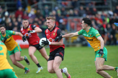 GAA-DOWN-v-DONEGAL-Liam-Kerr-drives-through-the-Donegal-defence-before-firing-home-Downs-first-goal