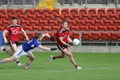 Caolan-Mooney-attempts-to-flick-the-ball-over-the-bar-but-it-drops-in-to-the-Laios-keepers-hands-and-he-fumbles-it-and-the-ball-ends-up-in-the-b