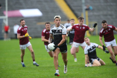 GAA-KILCOO-v-BALLYBAY-Dylan-Ward-looks-for-options-to-deliver-the-ball