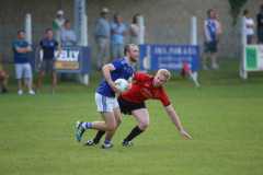 GAA-Warrenpoints-Patrick-Murdock-clears-his-lines-as-Rostrevors-James-Rice-Slips