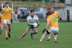 Burrens-Conor-Toney-takes-on-Clonduff-pair-Finbarr-McConville-and-Packie-OHagan
