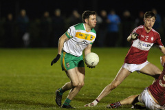 An-Riochts-Conor-Doyle-moves-the-ball-forward-as-Drumgaths-Shea-Byrne-attempts-to-block