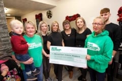 The-Barber-Shop-cheque-to-MacMillan
