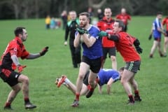 under-30s-player-Tomas-Mulholland-goes-past-the-old-guard-of-Shaun-Parr-and-Jarlath-Farrell