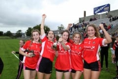 Dundrum-players-celebrate-with-Junior-Championship-Cup