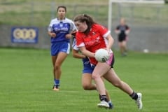Dundrums-Rachelle-Connolly-drives-upfield-with-the-ball