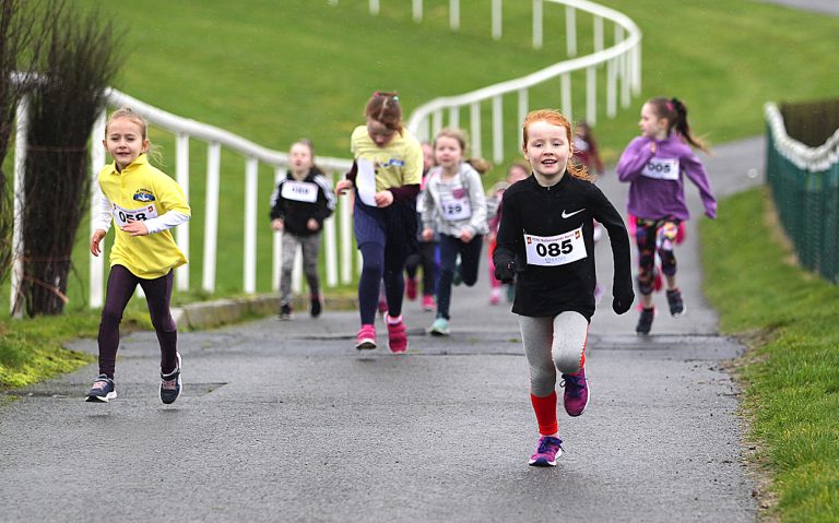 Children gallop round the racecourse as East Down Athletic Club stages its Rollercoaster races